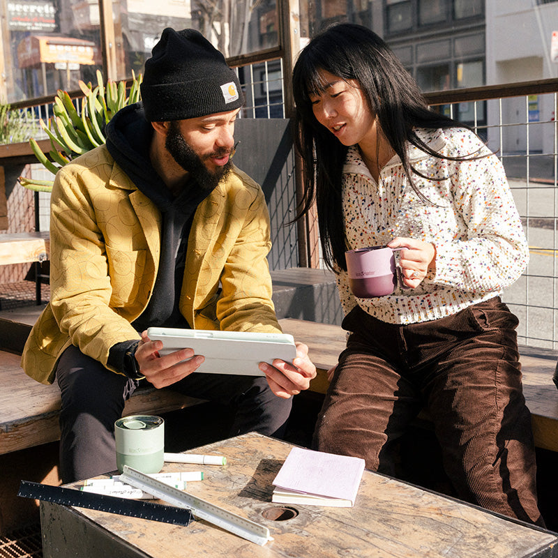 12oz-rise-mug-s6 12oz_rise_coffee_mug_dusty_orchid_couple_city_patio_square.jpg