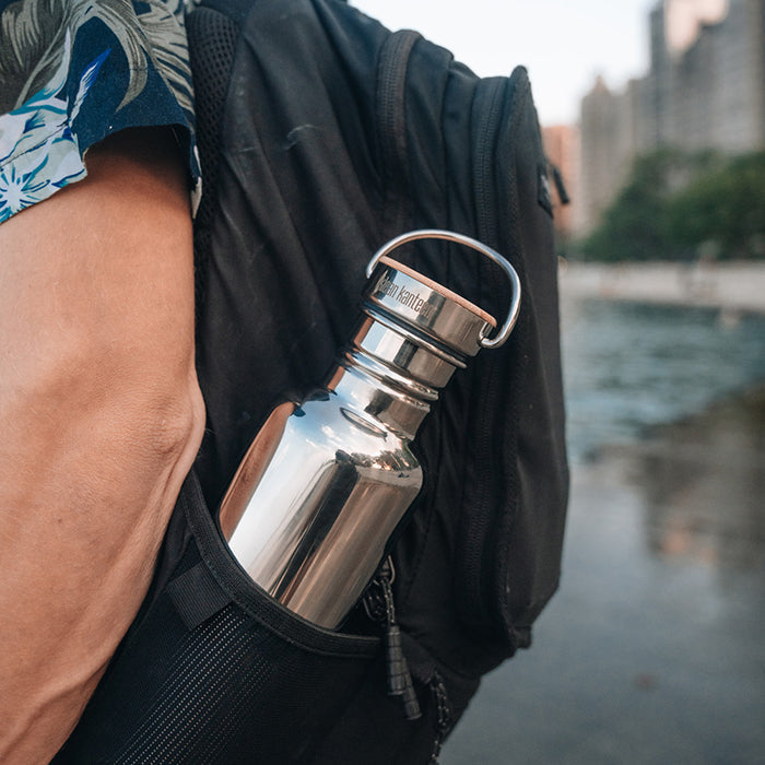 27oz-reflect-with-bamboo-cap-g5 K27SSLRF-MS-BAMBOO_reflect-bottle_backpack_lifestyle.jpg