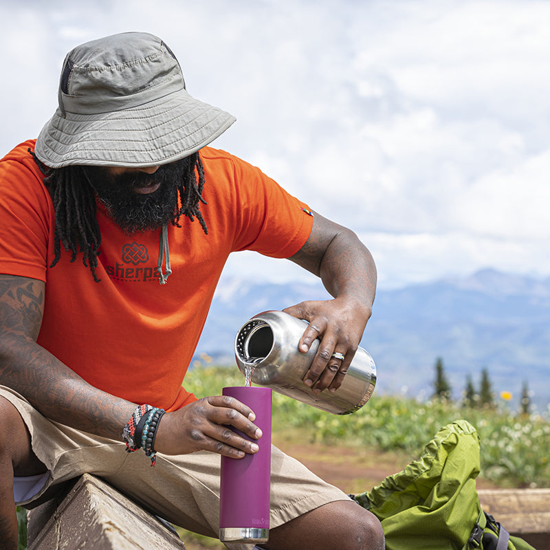 64oz-tkwide-with-loop-cap-e0 tkwide_64oz_bottle_backpacker_mountains_filling_square.jpg