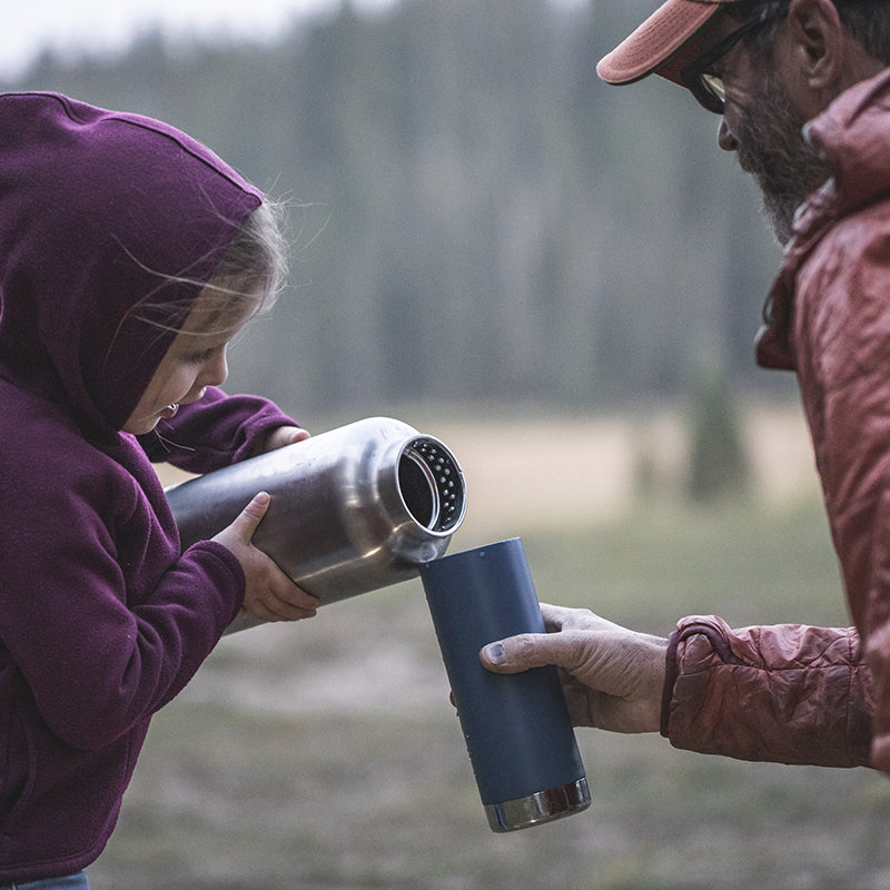 64oz-tkwide-with-loop-cap-e0 tkwide_64oz_bottle_girl_dad_filling_square.jpg